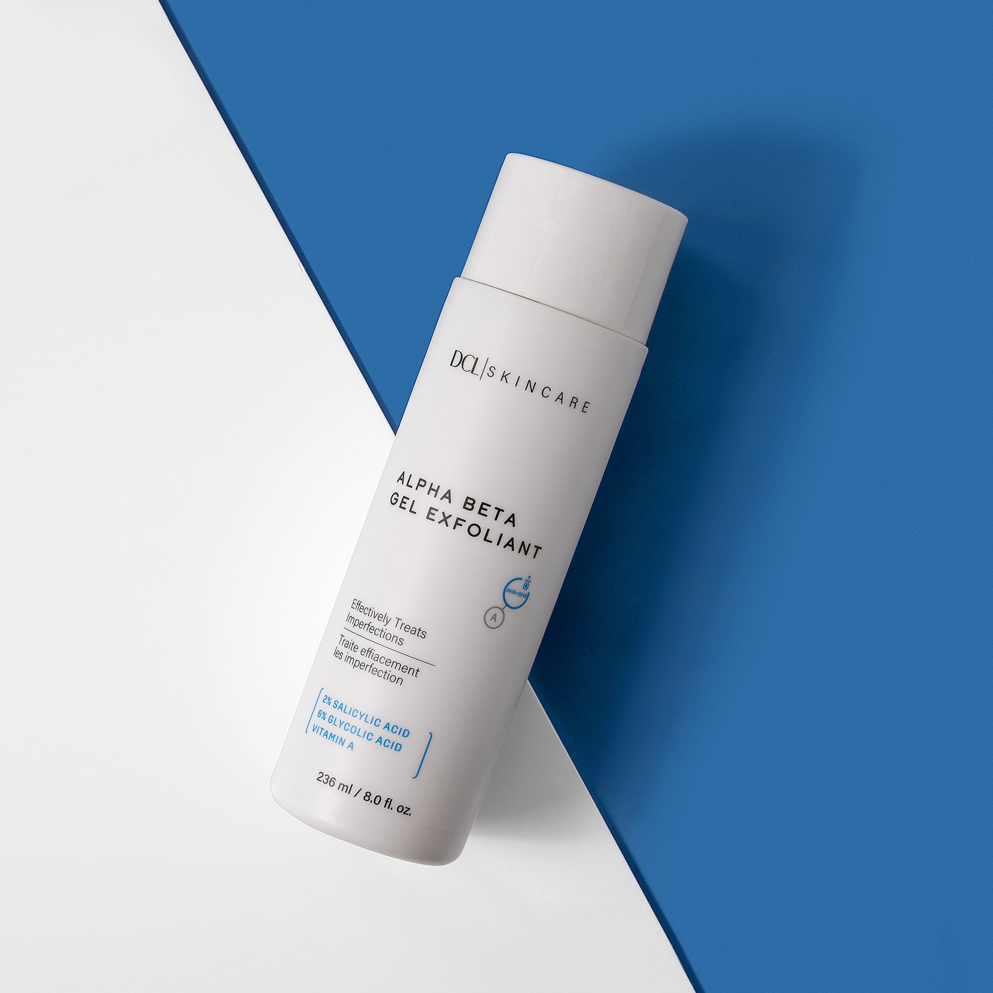 Alpha Beta Gel Exfoliant flat lay against blue and white background