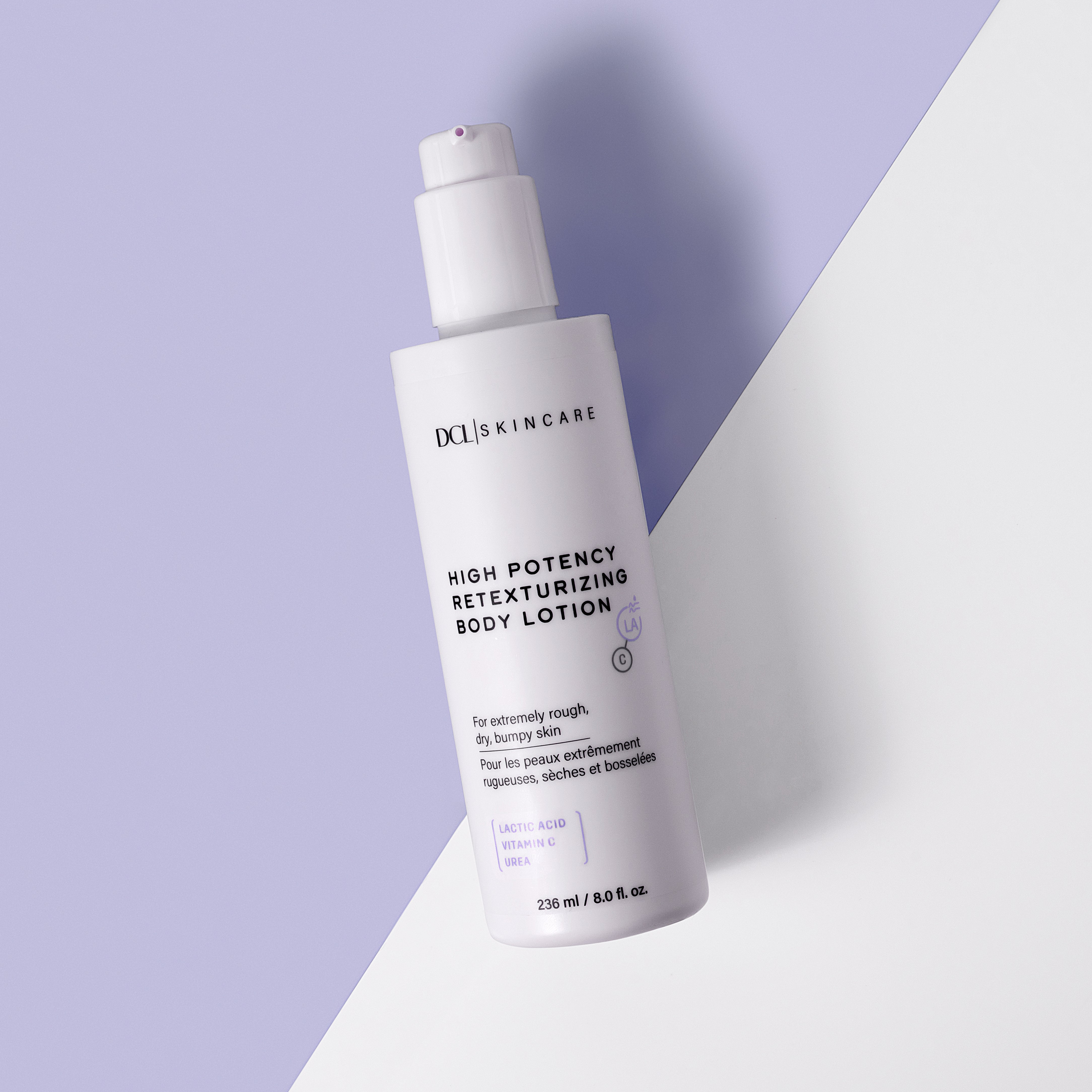 Retexturizing Body Lotion flat lay against white and lavender background